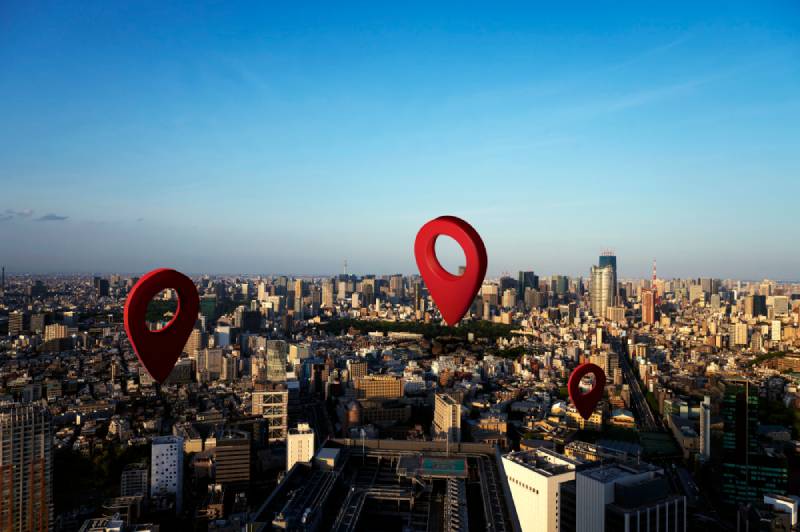 Cityscape with red location markers superimposed